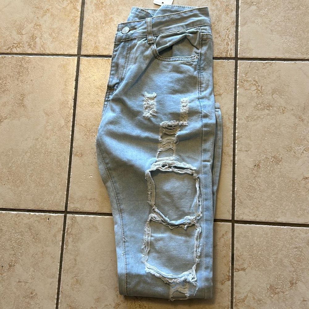 Distressed ripped light blue faded jeans size small